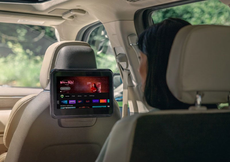 A person is seated in a 2023 Lincoln Nautilus SUV viewing an available entertainment screen. | Evergreen Lincoln in Issaquah WA