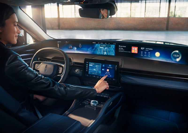 The driver of a 2024 Lincoln Nautilus® SUV interacts with the center touchscreen. | Evergreen Lincoln in Issaquah WA