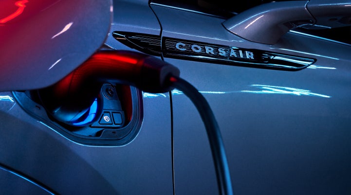 A charger plugged into the charging port of a 2024 Lincoln Corsair® Plug-in Hybrid model. | Evergreen Lincoln in Issaquah WA